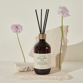 a bottle of aromatherapy with sticks