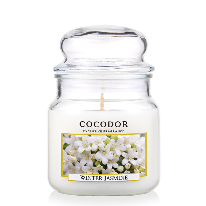 a white candle in a jar