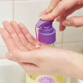 a person pouring liquid onto their hands