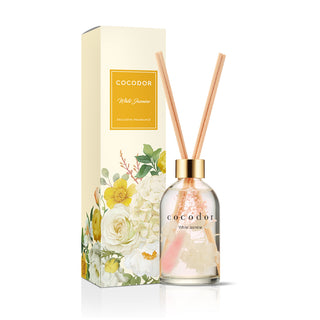 a bottle of reed diffuser with sticks