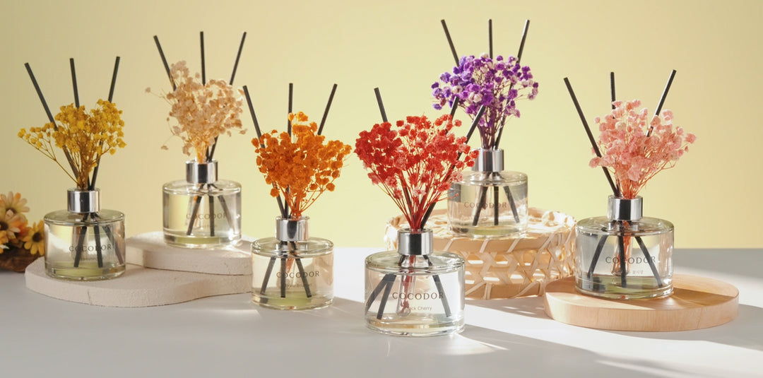 a group of small bottles with flowers in them