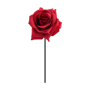 a red rose on a stick