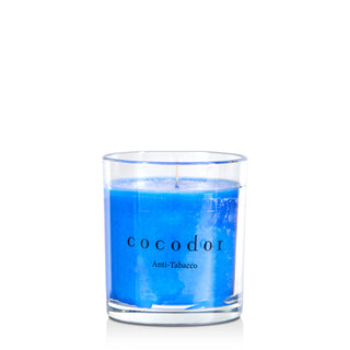 a blue candle in a glass container