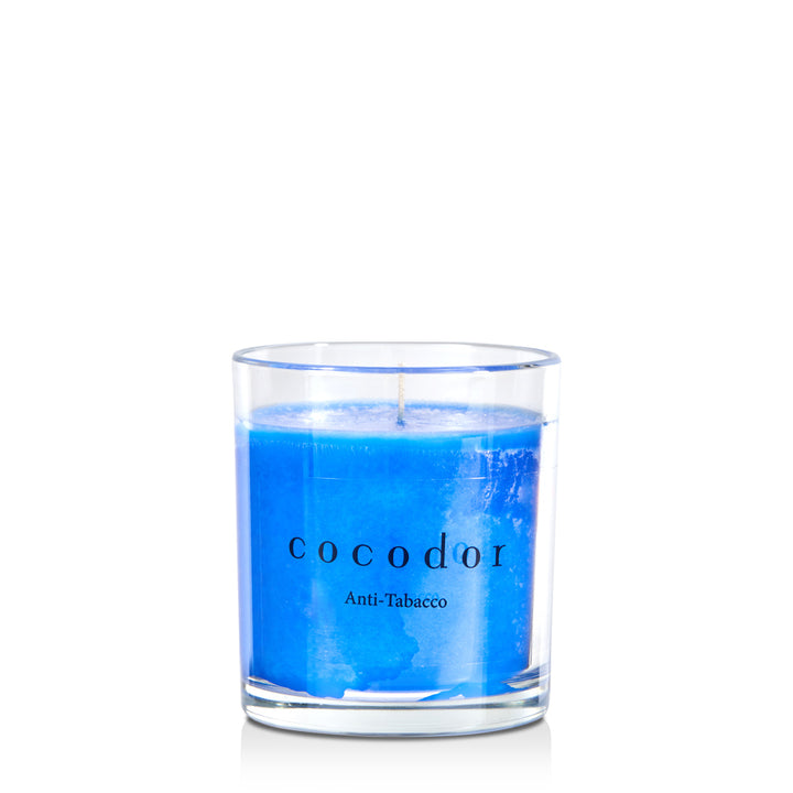 a blue candle in a glass container