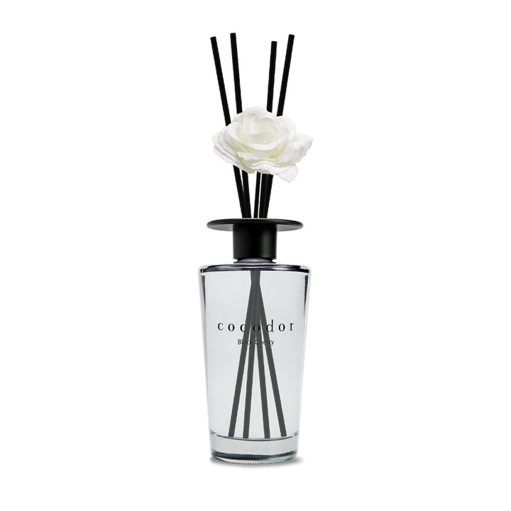 a white flower in a glass bottle