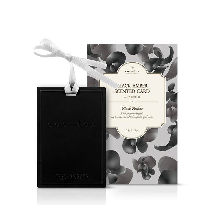 a black card with a white ribbon