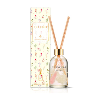a bottle of reed diffuser with sticks