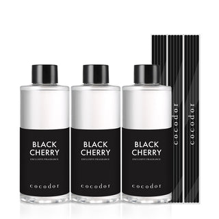 a group of bottles with black labels