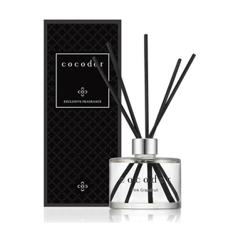 a bottle of reed diffuser with black sticks